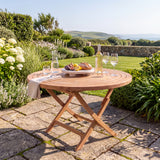 Teak Garden Furniture Spiral 120cm Round Folding Table 4cm Top - Sculptural Folding Teak Dining Table - UK and Ireland garden setting - image 2 Teak Garden Furniture Spiral 120cm Round Folding Table 4cm Top - Sculptural Folding Teak Dining Table - UK and Ireland garden setting - image 2