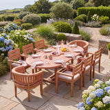 Teak 180-240cm Oval Extending Table with 6 Marlow Stacking Chairs & 2 San Francisco Chairs - Teak Garden Dining Set - UK and Ireland garden setting - image 1